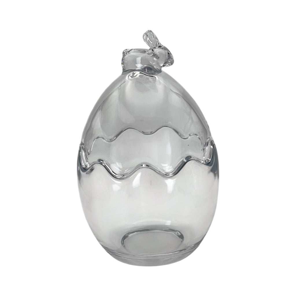 Œuf décoratif en verre transparent orné d’un petit nœud en haut. Parfait pour une décoration de Pâques chic et moderne. Peut être utilisé en centre de table ou vitrine.