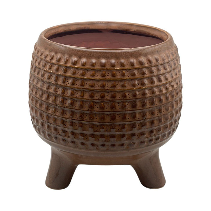 Pot décoratif en céramique marron avec motif sculpté, monté sur trois pieds, idéal pour plantes ou bougie, style vintage et chaleureux.